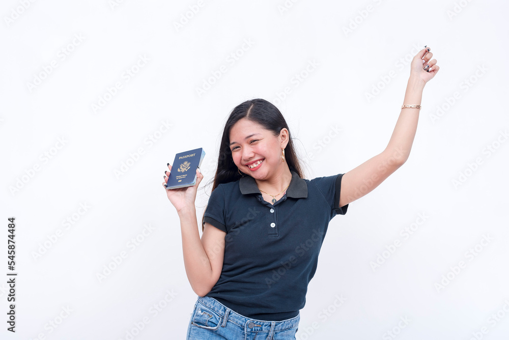 A happy asian woman celebrates after receiving her US passport. Isolated on a white background. A happy asian woman celebrates after receiving her US passport. Isolated on a white background.