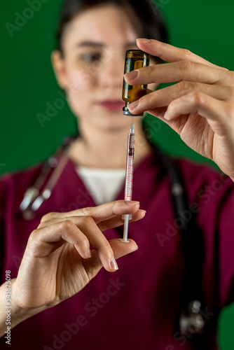  nurse hand holding flu vaccine syringe for injecting people.