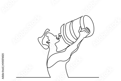 young man drinking water from big bottle very thirsty
