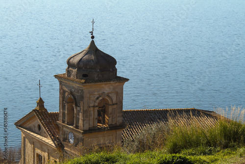 The Assumption of Mary Church in panoramic views ,built around 15th century with The square bell tower.Trevignano Romano,Italy