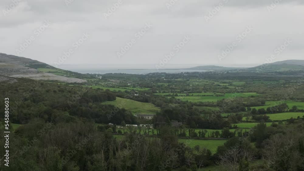 Vista looking out over Irish farmland with cloudy overcast skies Vista looking out over Irish farmland with cloudy overcast skies