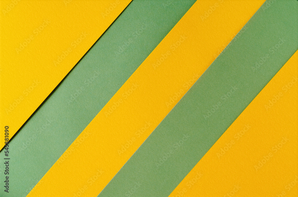 Background of yellow and green paper in bright colors, geometric pattern.