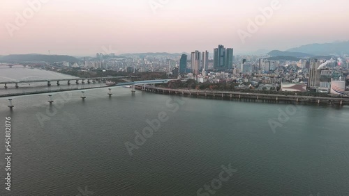 Seoul: Aerial view of capital city of South Korea, skyline of Hapjeong-dong with modern buildings (skyscrapers) at sunset, tree foliage in autumn colors - landscape panorama of East Asia from above photo