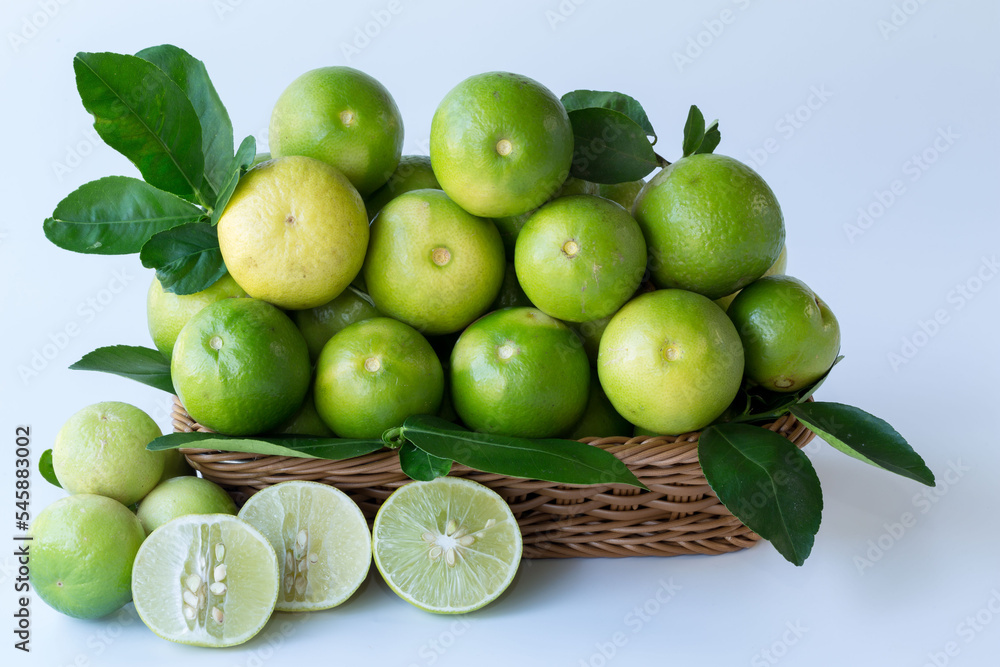 Fresh green lemons, in basket , Fresh green lemons at market and shop for sell.. Fresh green lemons, in basket , Fresh green lemons at market and shop for sell..