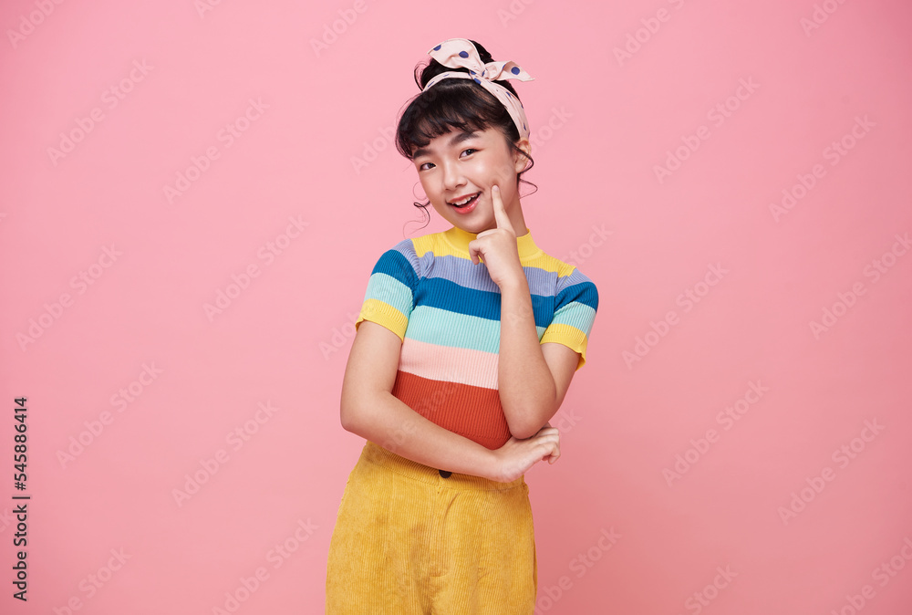 happy Asian child girl think and creativity isolated on pink background. happy Asian child girl think and creativity isolated on pink background.
