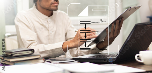 Businessman review document and sign approved first at workplace in office then another section will  approve allso, Business process flow sign approved 