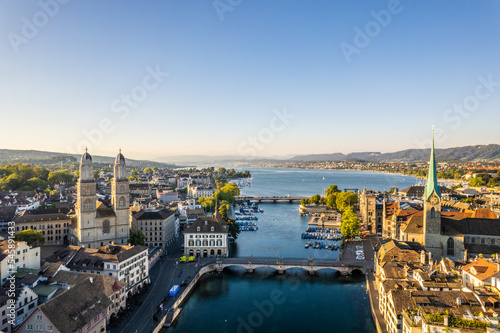 Aerial drone shot flying above Lake Zurich, Switzerland in sunny day.