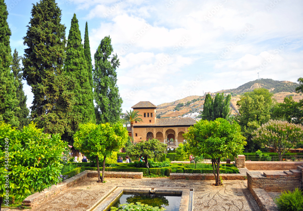 The Partal Palace surrounded by gardens and ponds in the Alhambra in Granada, Andalusia, Spain. The Alhambra is a UNESCO World Heritage Site in Andalusia