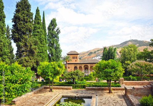 The Partal Palace surrounded by gardens and ponds in the Alhambra in Granada, Andalusia, Spain. The Alhambra is a UNESCO World Heritage Site in Andalusia © joserpizarro