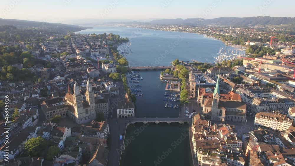 Aerial drone shot flying above Lake Zurich, Switzerland in sunny day. 