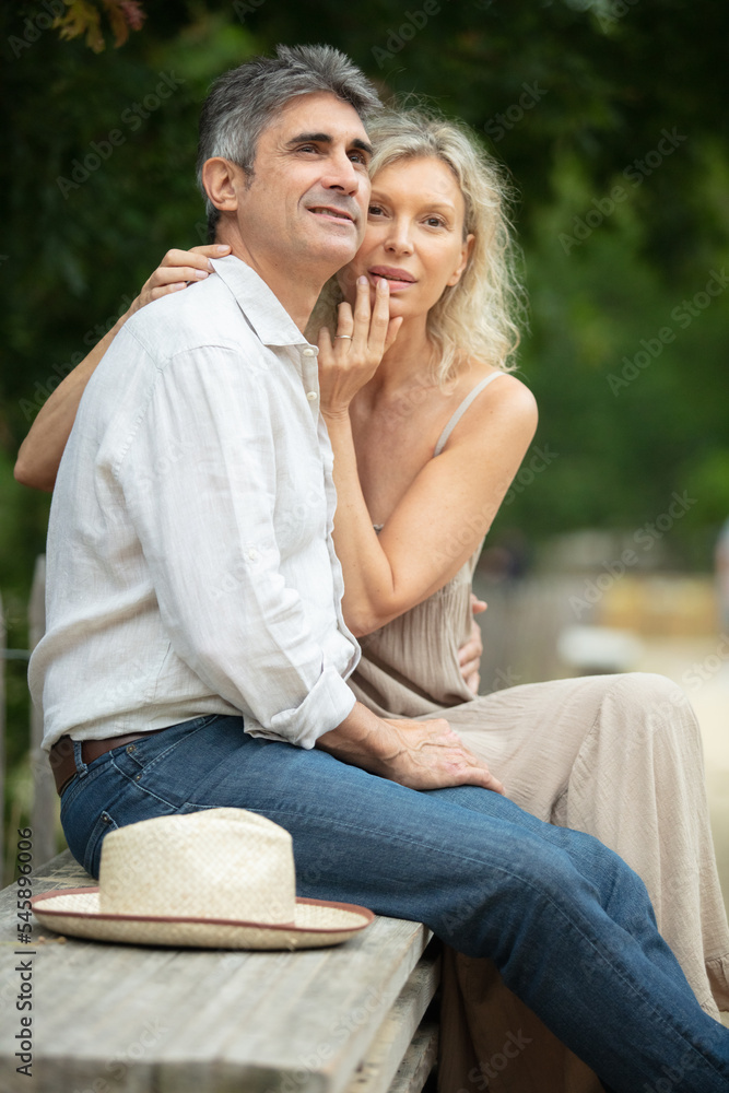 senior couple sitting on the bench looking the nature view senior couple sitting on the bench looking the nature view
