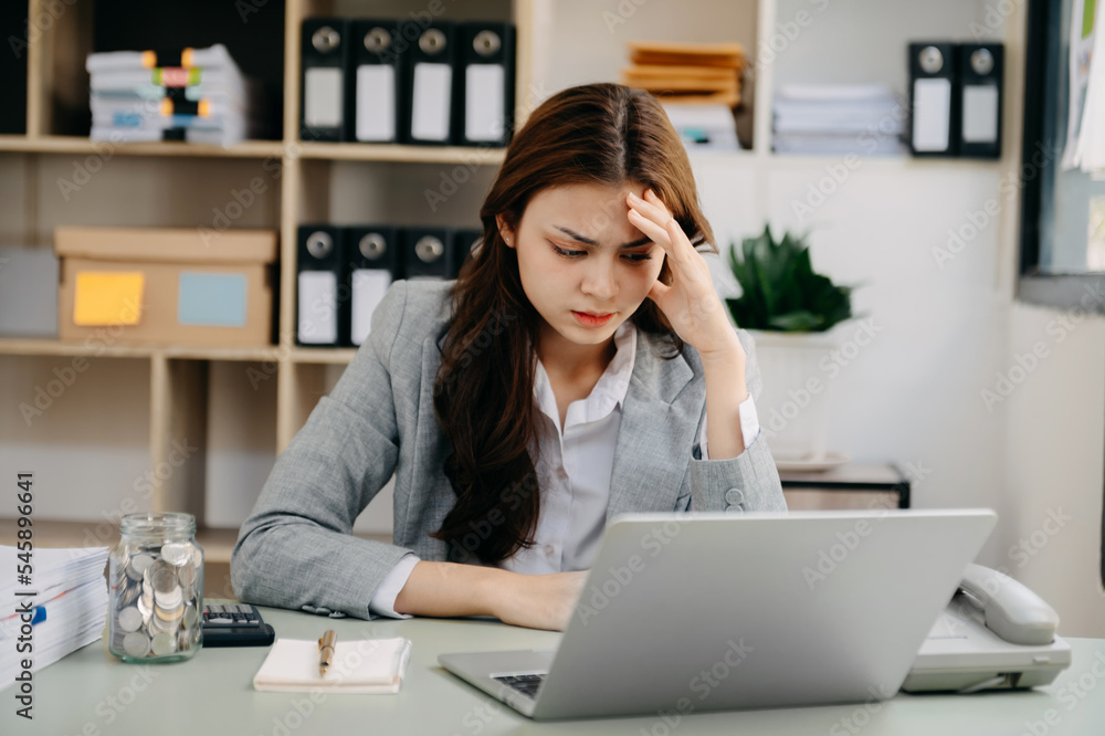 portrait of stressed business woman with social network diagram in the office. portrait of stressed business woman with social network diagram in the office.