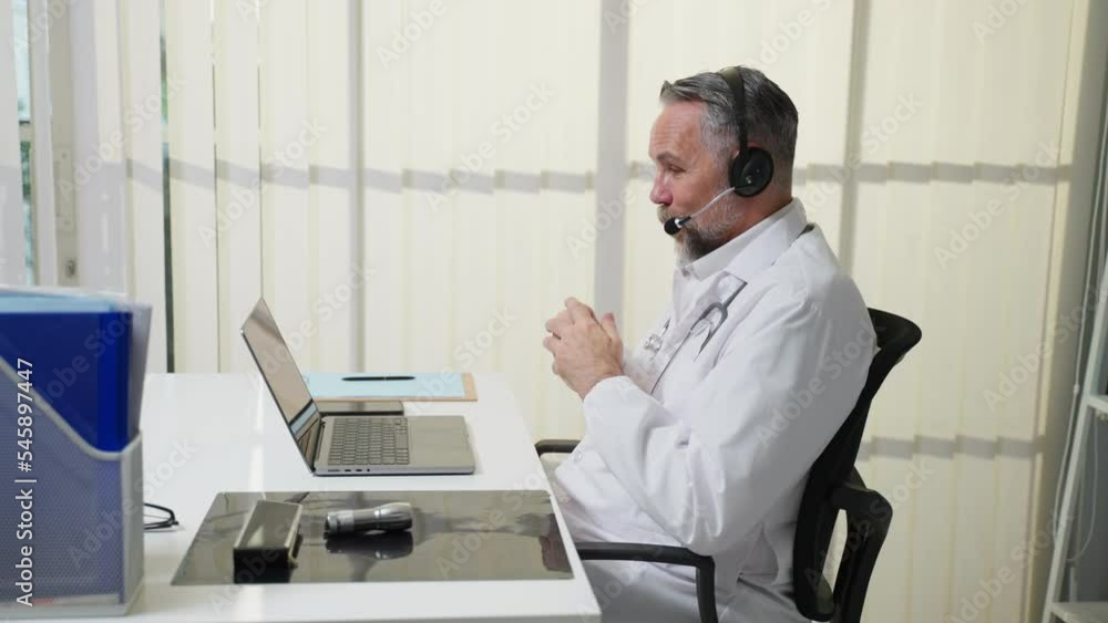 Caucasian senior male medical doctor talk virtual online with patient. Caucasian senior male medical doctor talk virtual online with patient.