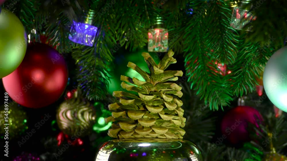 Christmas tree cone rotates against the background of decorated Christmas trees Christmas tree cone rotates against the background of decorated Christmas trees