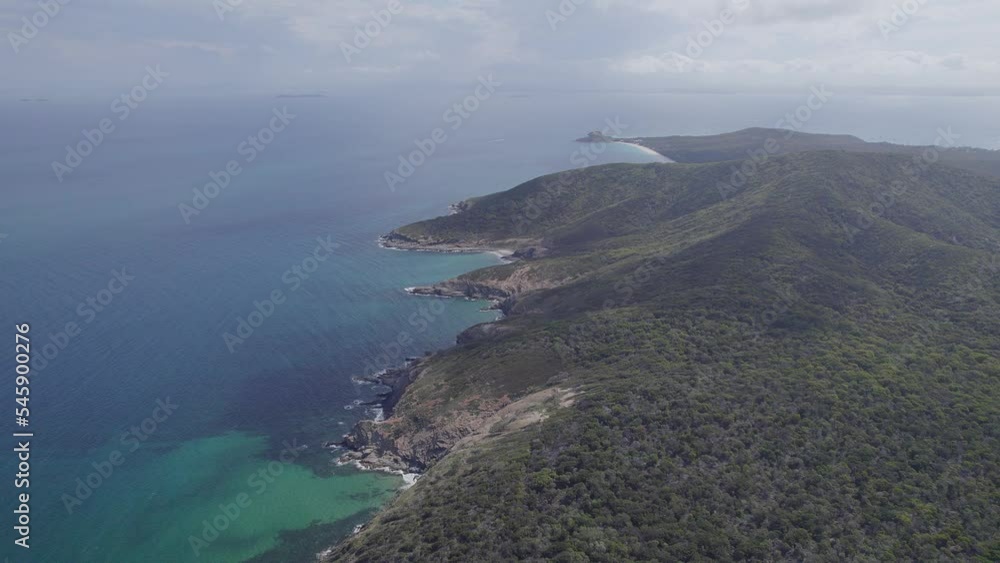 Seascape With Turquoise Ocean And Lush Mountains In Great Keppel Island, QLD, Australia - aerial drone shot Seascape With Turquoise Ocean And Lush Mountains In Great Keppel Island, QLD, Australia - aerial drone shot