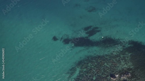 Aerial View Of Passage Rocks Reef In The Keppels. Popular Snorkeling Spot In The Great Barrier Reef, Queensland, Australia. drone tilt-up photo