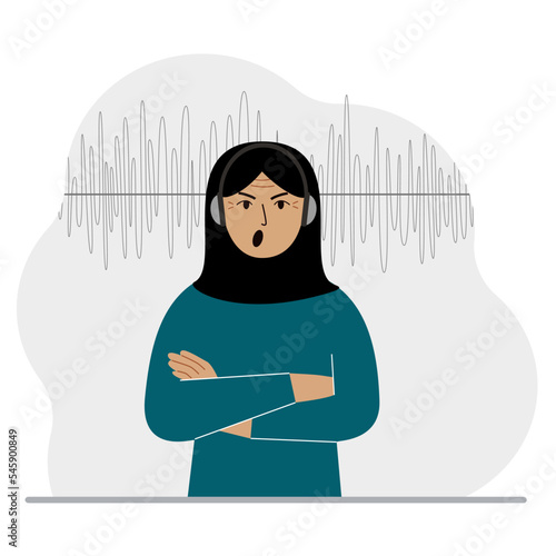 Muslim woman in headphones and a sound track. Concept of online podcast, radio, online books, online learning and music.