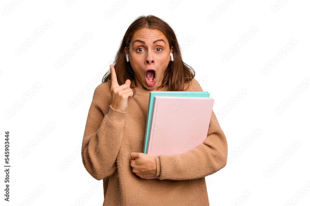 Young student woman holding a books isolated having an idea, inspiration concept. Young student woman holding a books isolated having an idea, inspiration concept.