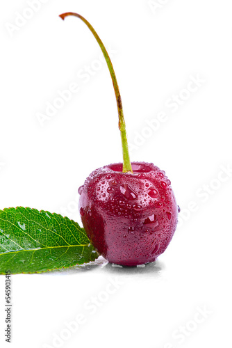 Ripe cherry in drops of water, isolated on a white background, macro photography