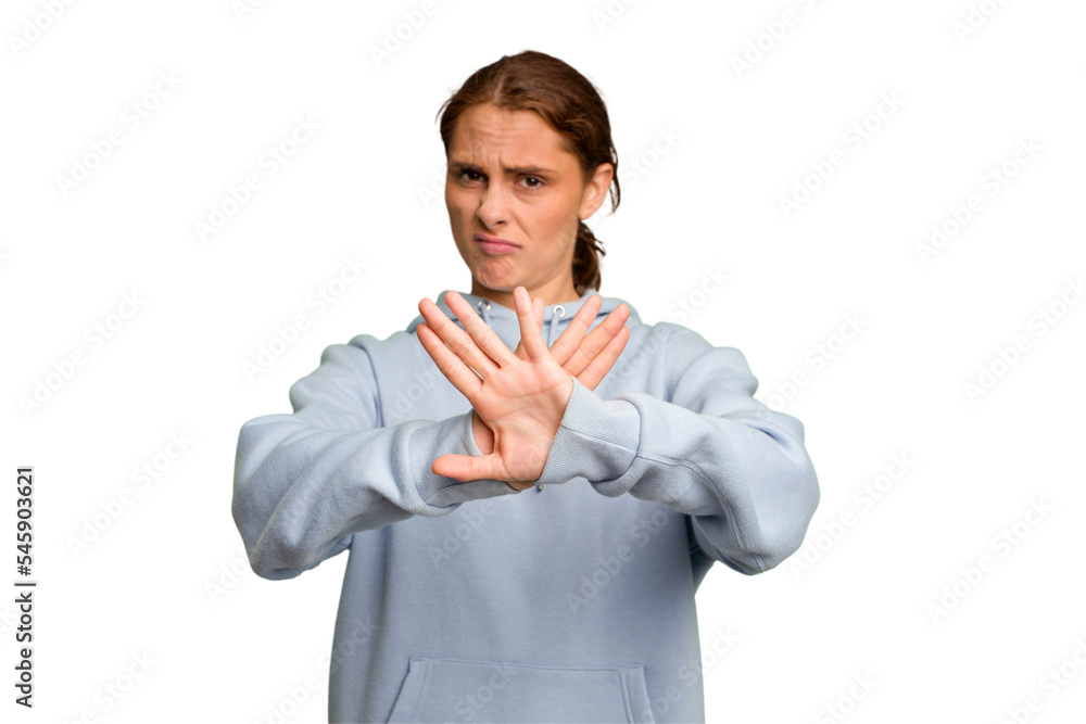 Young caucasian woman isolated standing with outstretched hand showing stop sign, preventing you. Young caucasian woman isolated standing with outstretched hand showing stop sign, preventing you.