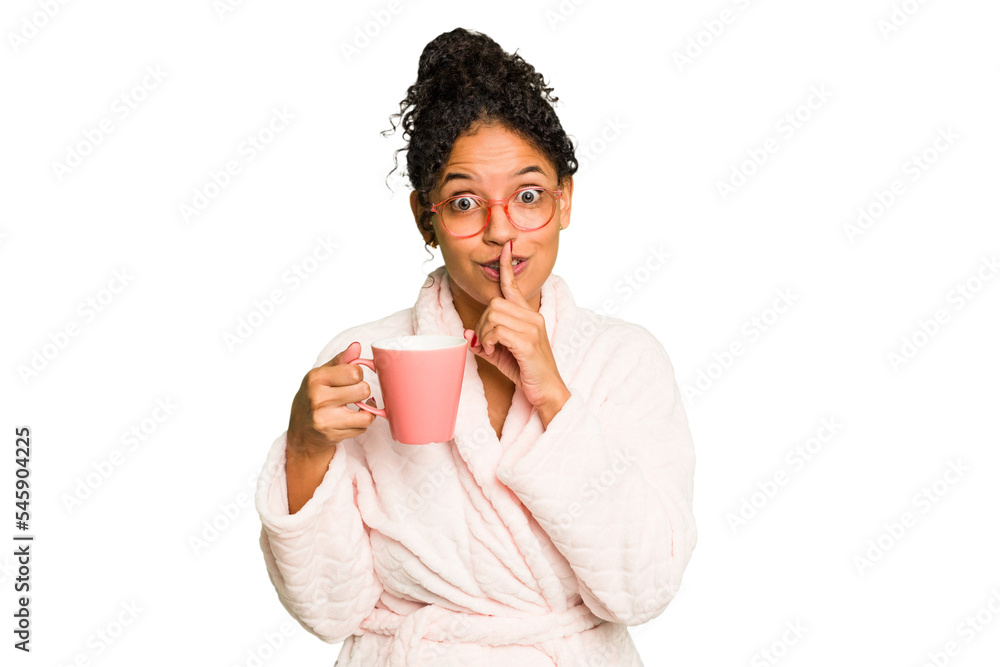 Young brazilian woman wearing a pajama holding a cup isolated keeping a secret or asking for silence. Young brazilian woman wearing a pajama holding a cup isolated keeping a secret or asking for silence.