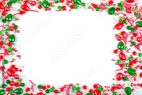 Frame of Christmas colorful candies, on a white background, close-up, copy space
