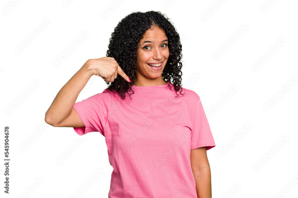 Young cute brazilian woman isolated person pointing by hand to a shirt copy space, proud and confident Young cute brazilian woman isolated person pointing by hand to a shirt copy space, proud and confident