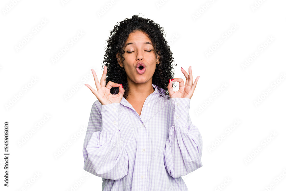 Young cute brazilian woman isolated relaxes after hard working day, she is performing yoga. Young cute brazilian woman isolated relaxes after hard working day, she is performing yoga.