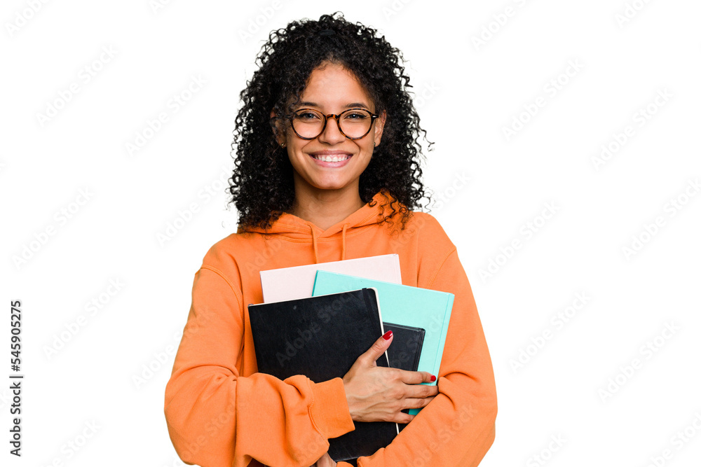 Young African american student woman holding a lot of books isolated Young African american student woman holding a lot of books isolated