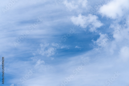 Beautiful sky background with picturesque cirrus clouds. Blue majestic sky with big pretty clouds. Clouds like wave.