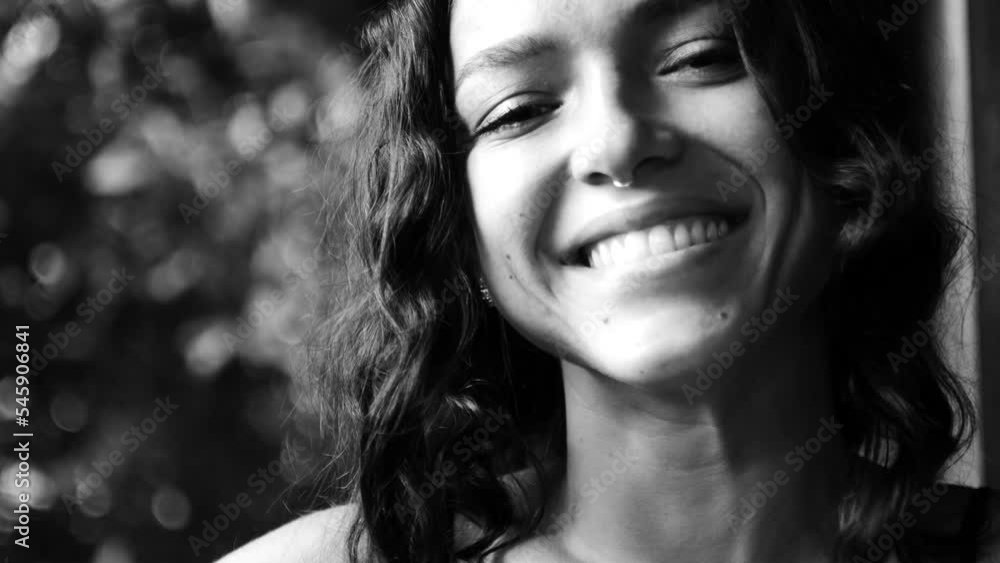 Young brunette woman laughing and smiling, black and white Young brunette woman laughing and smiling, black and white