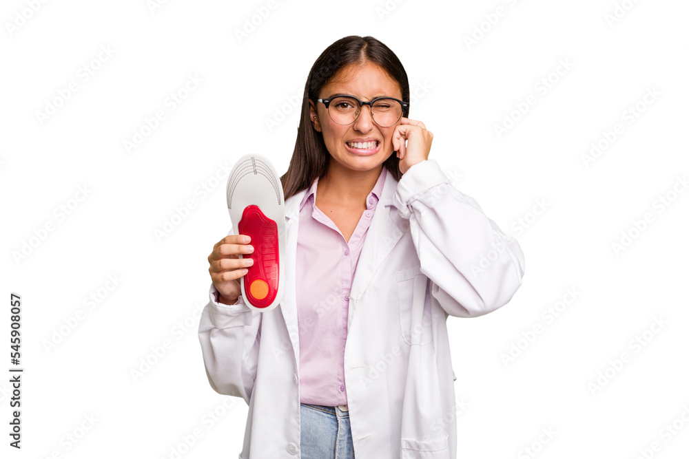 Young caucasian podiatrist woman isolated covering ears with hands. Young caucasian podiatrist woman isolated covering ears with hands.