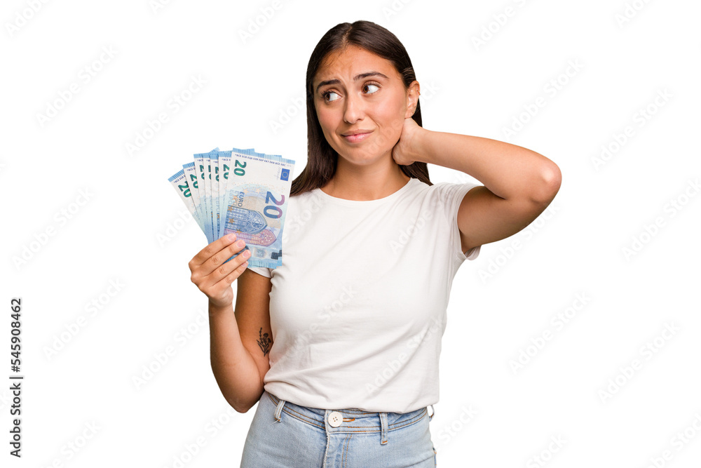Young caucasian woman holding a banknotes isolated touching back of head, thinking and making a choice. Young caucasian woman holding a banknotes isolated touching back of head, thinking and making a choice.