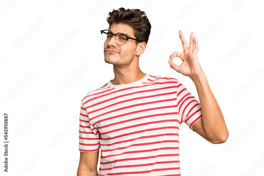 Young caucasian handsome man isolated winks an eye and holds an okay gesture with hand. Young caucasian handsome man isolated winks an eye and holds an okay gesture with hand.