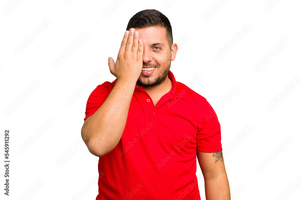 Young caucasian man isolated having fun covering half of face with palm. Young caucasian man isolated having fun covering half of face with palm.