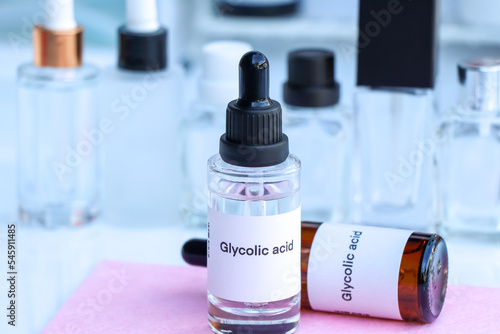Glycolic acid in a bottle, chemical ingredient in beauty product photo