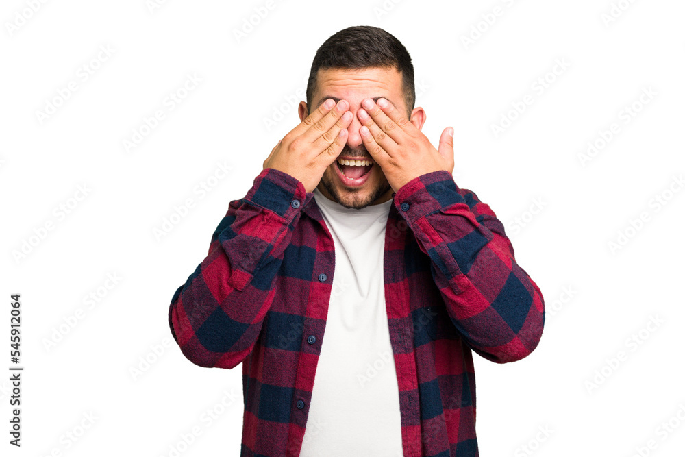 Young caucasian man isolated covers eyes with hands, smiles broadly waiting for a surprise. Young caucasian man isolated covers eyes with hands, smiles broadly waiting for a surprise.