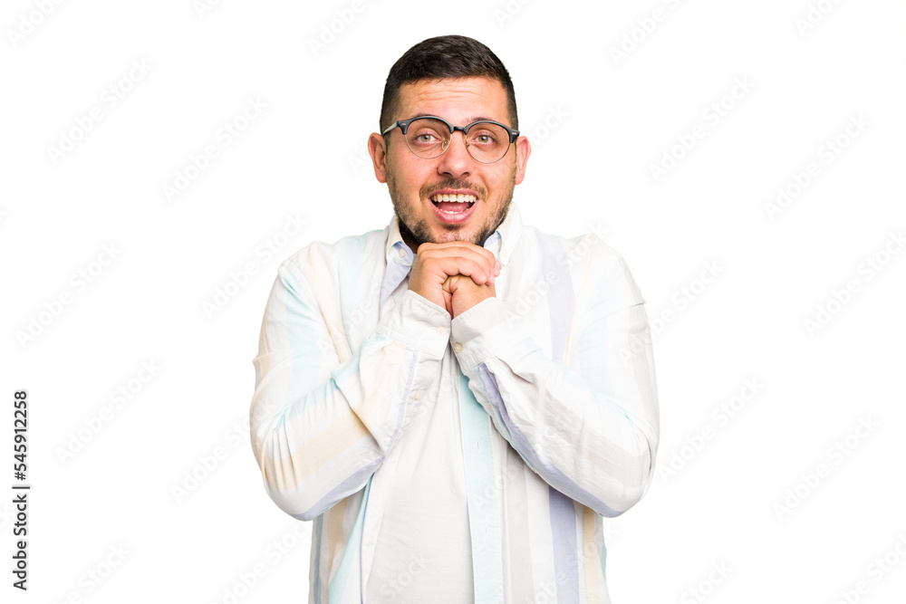 Young caucasian man isolated praying for luck, amazed and opening mouth looking to front. Young caucasian man isolated praying for luck, amazed and opening mouth looking to front.