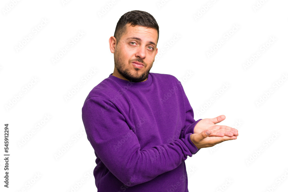 Young caucasian man isolated holding a copy space on a palm. Young caucasian man isolated holding a copy space on a palm.