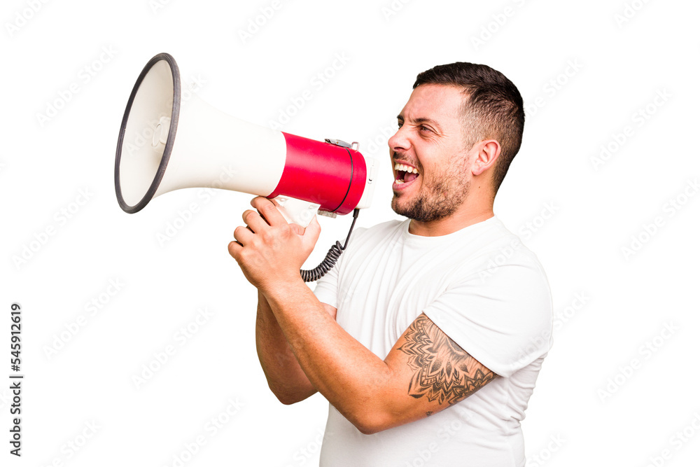 Young caucasian man holding a megaphone isolated Young caucasian man holding a megaphone isolated