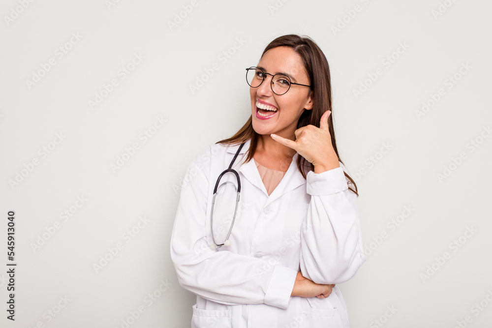 Young doctor woman isolated on white background showing a mobile phone call gesture with fingers. Young doctor woman isolated on white background showing a mobile phone call gesture with fingers.