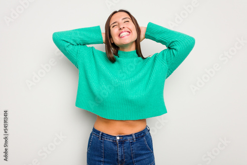 Young caucasian cute woman isolated on white background feeling confident, with hands behind the head.