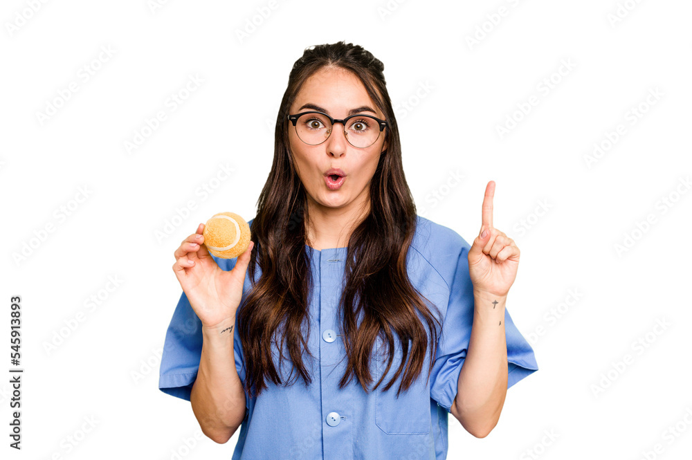 Young caucasian physiotherapist woman holding a tennis ball isolated isolated on green chroma background having some great idea, concept of creativity. Young caucasian physiotherapist woman holding a tennis ball isolated isolated on green chroma background having some great idea, concept of creativity.