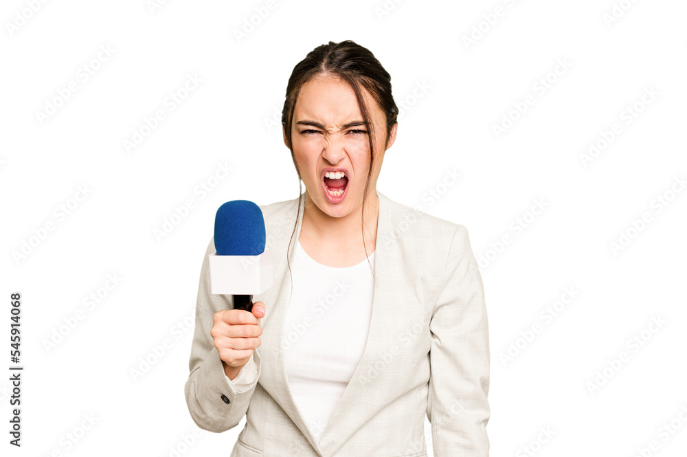 Young TV presenter caucasian woman isolated on green chroma background screaming very angry and aggressive. Young TV presenter caucasian woman isolated on green chroma background screaming very angry and aggressive.