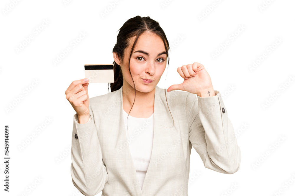 Young caucasian woman holding a credit card isolated on green chroma background feels proud and self confident, example to follow. Young caucasian woman holding a credit card isolated on green chroma background feels proud and self confident, example to follow.