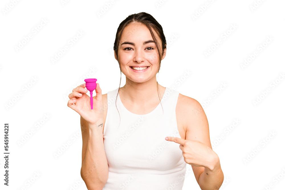 Young caucasian woman holding menstrual cup isolated on green chroma background person pointing by hand to a shirt copy space, proud and confident Young caucasian woman holding menstrual cup isolated on green chroma background person pointing by hand to a shirt copy space, proud and confident