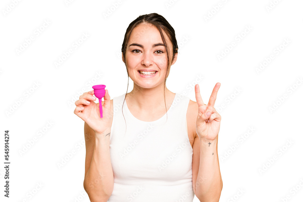 Young caucasian woman holding menstrual cup isolated on green chroma background showing number two with fingers. Young caucasian woman holding menstrual cup isolated on green chroma background showing number two with fingers.