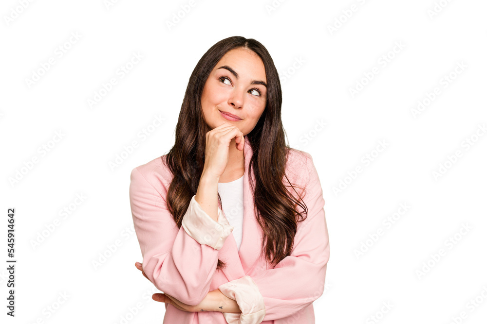 Young caucasian woman isolated on green chroma background relaxed thinking about something looking at a copy space. Young caucasian woman isolated on green chroma background relaxed thinking about something looking at a copy space.