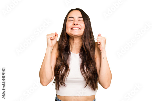 Obraz na plátně Young caucasian woman isolated on green chroma background celebrating a victory, passion and enthusiasm, happy expression
