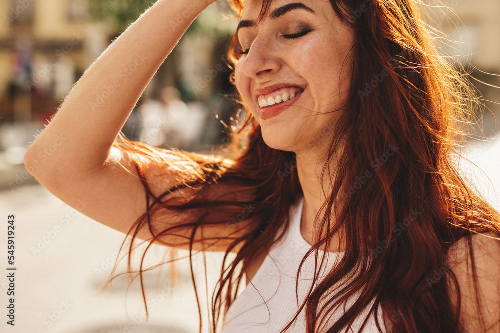 © Jacob Lund - Woman with ginger hair enjoying herself in the city © Jacob Lund - Woman with ginger hair enjoying herself in the city